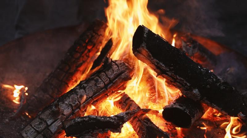 Close-up of the crackling campfire inside the castle grounds