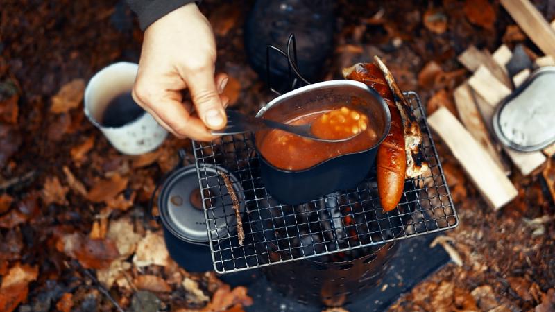 Breakfast outdoors: baked beans, sausage and coffee